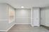 Dining area with wood-style flooring, window, and nearby entry door and closet