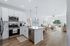 Bright open-concept kitchen and living space with modern appliances, elegant countertops, and inviting natural light.