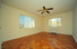 Bright, spacious room with large windows offering scenic views and beautiful parquet flooring.