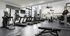 The Oslo's state-of-the-art fitness studio, equipped with the latest exercise machines and ample space for workout routines. The studio features a bright, airy environment with floor-to-ceiling windows that provide natural light and views of the surrounding area, ideal for energizing fitness sessions.