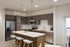 Spacious and modern kitchen in two-bedroom layout at The Oslo, featuring high-end finishes and a layout that caters to both cooking and socializing.