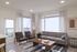 Elegant living room in two-bedroom layout at The Oslo, designed for comfort and style, with plush seating and chic decor that welcomes relaxation and entertainment.