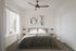 Bright and airy bedroom in A1 layout at The Oslo, showcasing minimalist decor and ample natural light for a serene ambiance.