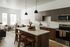 Open-plan kitchen and living area in A1 layout at The Oslo, with contemporary furnishings and state-of-the-art appliances for a luxurious living experience.