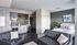 Spacious living room with modern furnishings and natural light
