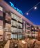 The Lofts at City Center exterior at night with illuminated facade and balconies