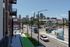 View down Grand Boulevard of the KC Streetcar, a protected bike lane and the downtown Kansas City skyline