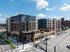 Aerial view of The Wade on a River Market corner, with the pool courtyard, amenity terrace and streets below