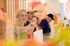 Joyful customers enjoying a vibrant ice cream shop experience, with colorful decor and delicious treats.