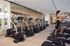 Luxurious apartment gym with modern cardio equipment and elegant design, perfect for a rejuvenating workout experience.