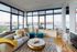 Inviting living room with panoramic waterfront views, plush seating, and chic decor for a perfect blend of comfort and style.