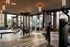 Modern fitness center with state-of-the-art equipment, large windows, and stylish lighting for an inspiring workout environment.
