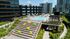 Stunning rooftop pool with vibrant seating and lush landscaping, offering a luxurious urban escape.