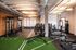 Modern gym with sleek fitness equipment and stylish lighting, offering a vibrant workout space.