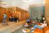 Modern apartment lobby with stylish wood paneling, cozy seating, and contemporary decor.