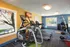 Agora at Port Richey, interior, fitness center, large windows, weights, ellipticals