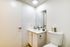 Contemporary bathroom with sleek design features a modern sink and chic decor.