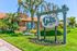Charming apartment complex with lush landscaping and The Gallery sign, offering 1 to 3 bedroom homes.