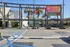 Vibrant shopping plaza showcasing diverse dining options including Subway, Rubio's Coastal Grill, and Lantern Garden under sunny skies with palm trees.