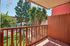 Charming balcony view overlooking lush greenery, with a playful touch of butterfly decorations.