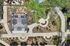 Aerial view of a beautifully landscaped garden featuring a pergola with outdoor seating, walking paths, and lush greenery, perfect for relaxation and social gatherings.