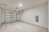 Luxe of Prosper | Apartments in McKinney | Rental in McKinney | Spacious, clean garage with smooth flooring and modern garage door, perfect for secure parking or storage.