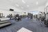 Modern fitness center featuring state-of-the-art exercise equipment, bright natural lighting, and sleek design.