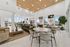 Luxurious open-concept lounge with chic seating, modern decor, and expansive windows providing stunning views.