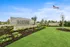 Private fenced backyard with green lawn at single-family rental home in Denton TX near Rayzor Ranch
