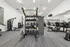 Fitness center with weights and cardio equipment at Denton TX rental home community near UNT
