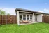 Private fenced backyard with covered porch at rental home in Denton TX near Rayzor Ranch