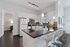 Modern kitchen with sleek appliances, elegant pendant lighting, and a spacious island for entertaining.