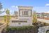 Entrance sign for The Luxe of McKinney, a private rental community with elegant landscaping and modern architecture.