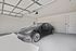 Modern garage featuring a sleek electric vehicle with ample space and pristine finish.
