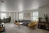 Bright and inviting living room featuring modern decor, a cozy gray sofa, stylish wooden coffee table, and lush green plants accented by large windows.