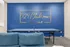 Chic recreation room with a vibrant blue accent wall, featuring stylish '1924 Clubroom Webster Hall' signage and a professional table tennis setup.