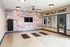 Modern fitness room with motivational wall art, exercise mats, and a sleek design.