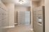 Modern package room with sleek, secure locker systems and stylish tile flooring, perfect for convenient and safe deliveries.