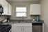 Stylish kitchen interior featuring granite countertops and modern appliances.