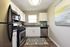 Modern kitchen featuring stainless steel appliances, granite countertops, and stylish cabinetry.