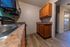 Stylish kitchen with wooden cabinets, sleek countertops, and modern appliances.