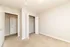 Bright, cozy bedroom with plush carpeting and convenient double-door closet.