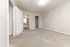 Bright, spacious bedroom with plush carpet and access to a modern en-suite bathroom.