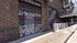 Vibrant wall mural with inspiring peace and dreamer quotes in a modern urban setting, featuring industrial brick and metal staircase architecture.