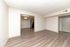 Elegant apartment with modern hardwood flooring, open living space, and stylish lighting.