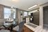 Elegant kitchen and dining area featuring modern appliances, stylish decor, and abundant natural light.