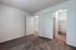 Inviting bedroom with plush carpet and a spacious walk-in closet, perfect for comfortable living.