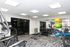 Modern fitness center featuring state-of-the-art cardio machines, free weights, and vibrant exercise balls, perfect for an energizing workout experience.