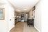 Modern kitchen with sleek stainless steel appliances, stylish gray cabinets, and a cozy breakfast nook, offering a blend of elegance and functionality.