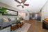 Modern apartment featuring an open-concept design with a cozy living area, elegant gray kitchen, and stylish decor accents.